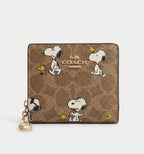 NWT Coach X Peanuts Snap Wallet In Signature Canvas With Snoopy Print CBN32 Tan